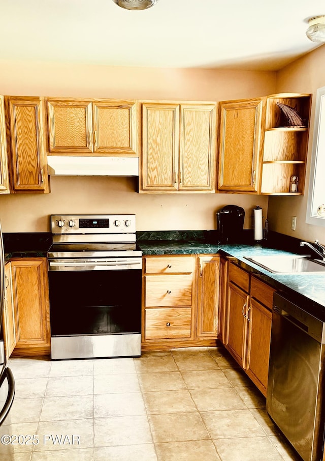 129 Skyview Rd, Dingmans Ferry, PA 18328 - kitchen with stainless steel appliances, under cabinet range hood, dark countertops, and light tile patterned floors