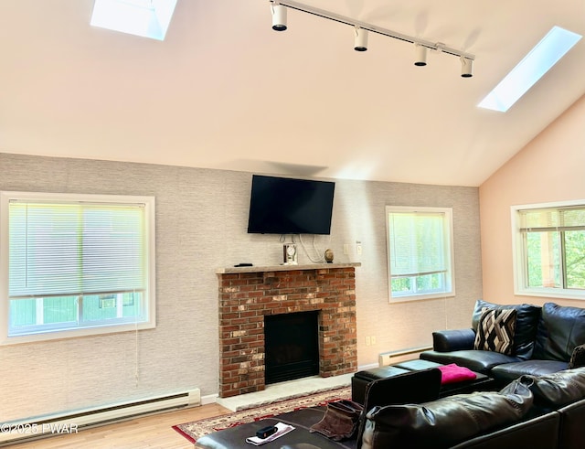 129 Skyview Rd, Dingmans Ferry, PA 18328 - living area featuring a skylight, rail lighting, baseboard heating, wood finished floors, and lofted ceiling