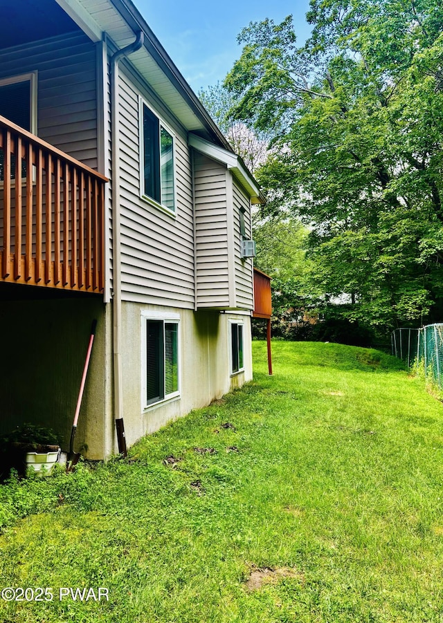 129 Skyview Rd, Dingmans Ferry, PA 18328 - view of side of property featuring a lawn and a deck