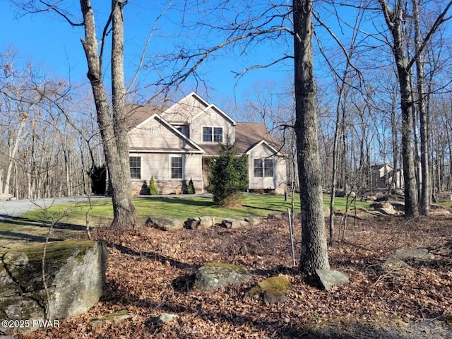traditional-style home with a front lawn