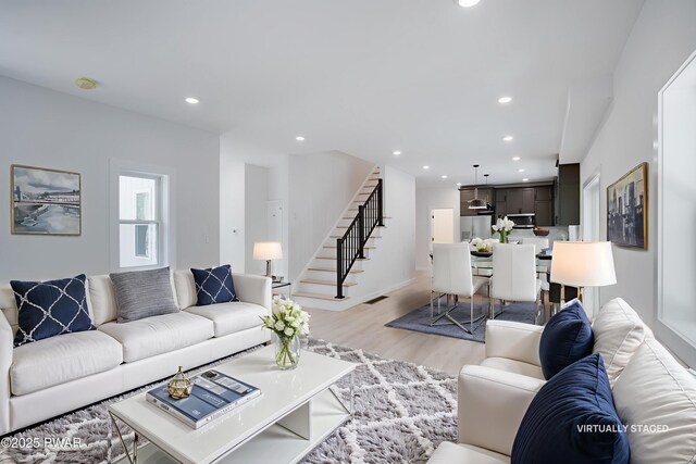 131 Song Mountain Dr, Tafton, PA 18464 - living room with stairway, light wood-style flooring, and recessed lighting