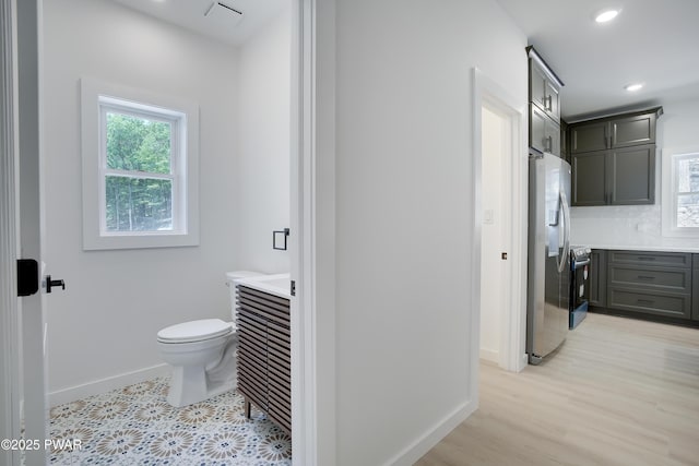 131 Song Mountain Dr, Tafton, PA 18464 - bathroom with vanity, tasteful backsplash, recessed lighting, and wood finished floors