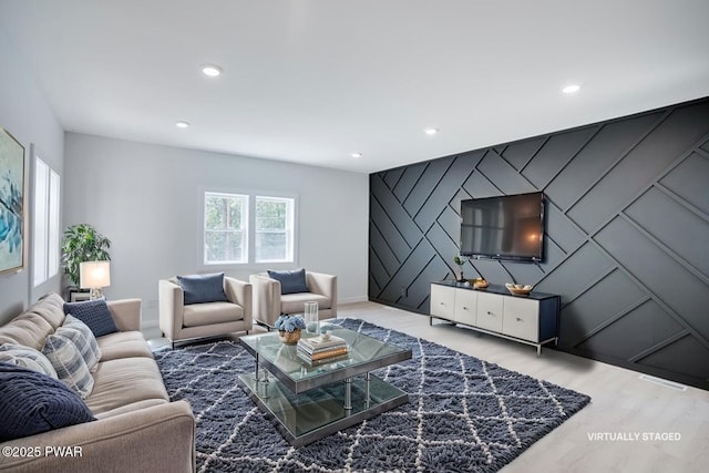 131 Song Mountain Dr, Tafton, PA 18464 - living area with an accent wall, wood finished floors, and recessed lighting