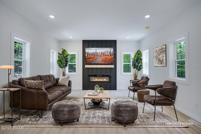 131 Song Mountain Dr, Tafton, PA 18464 - living room featuring plenty of natural light, a fireplace, recessed lighting, and wood finished floors
