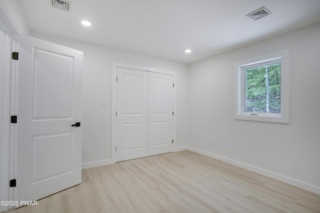 131 Song Mountain Dr, Tafton, PA 18464 - unfurnished bedroom with light wood-type flooring, recessed lighting, and a closet