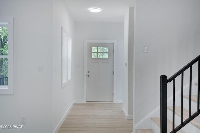 131 Song Mountain Dr, Tafton, PA 18464 - foyer entrance with light wood finished floors and stairs