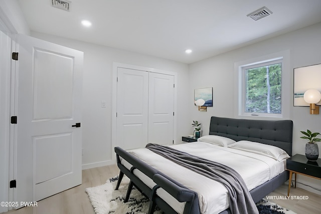 131 Song Mountain Dr, Tafton, PA 18464 - bedroom with light wood-type flooring, a closet, and recessed lighting