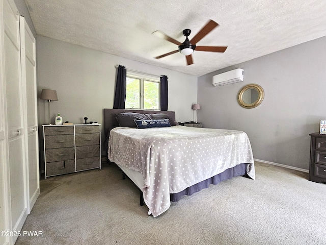 101 Summit Dr, Greentown, PA 18426 - bedroom featuring an AC wall unit, carpet flooring, a textured ceiling, and ceiling fan