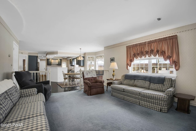 living room featuring carpet and wallpapered walls