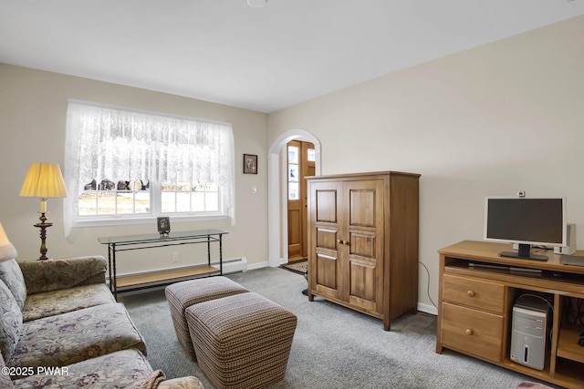 living area with light carpet, baseboards, a baseboard heating unit, and arched walkways