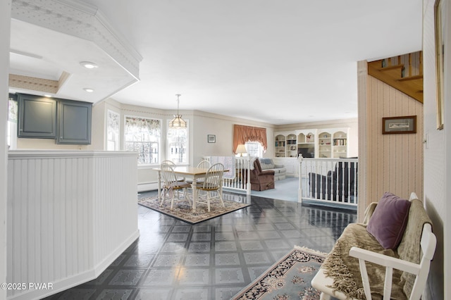 living area with a baseboard heating unit, dark floors, and wallpapered walls