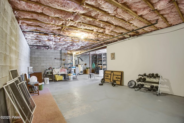 unfinished basement featuring water heater