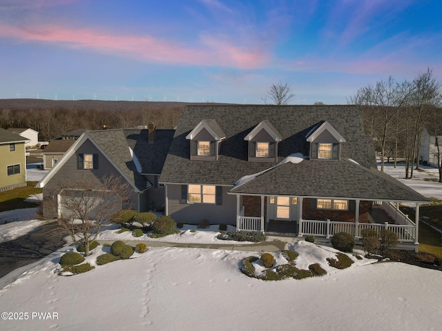 view of front of home with a porch and roof with shingles