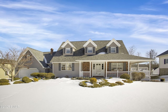 view of front of property with covered porch and a shingled roof