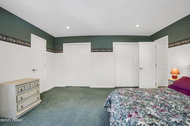 carpeted bedroom with recessed lighting, baseboards, and two closets