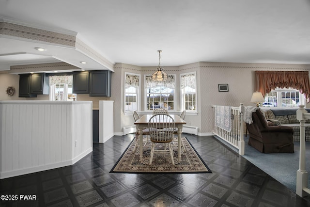 dining area featuring wallpapered walls, dark floors, and baseboards