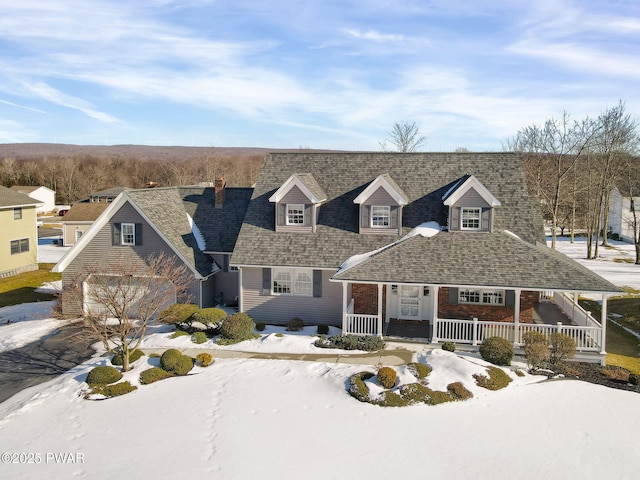 view of front of home featuring covered porch and roof with shingles