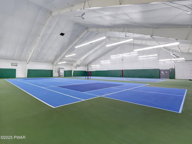 view of tennis court featuring community basketball court and fence