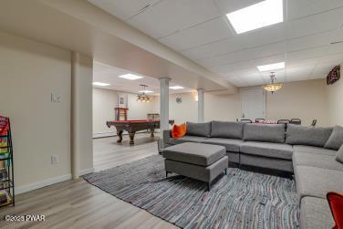 3043 Hemlock Rd, Stroudsburg, PA 18360 - living area featuring wood finished floors, billiards table, and baseboards