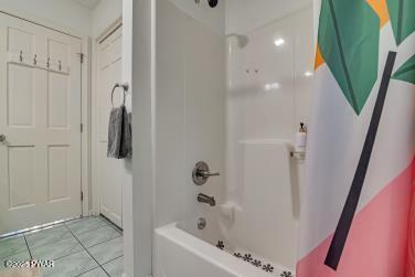3043 Hemlock Rd, Stroudsburg, PA 18360 - full bathroom with bathing tub / shower combination and tile patterned floors