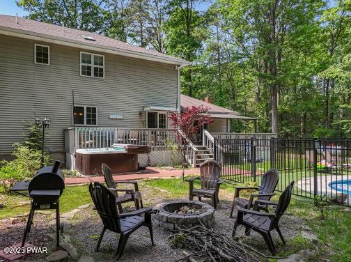 3043 Hemlock Rd, Stroudsburg, PA 18360 - view of patio / terrace with an outdoor fire pit, a hot tub, and a deck