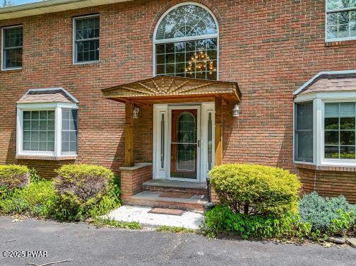 3043 Hemlock Rd, Stroudsburg, PA 18360 - doorway to property featuring brick siding