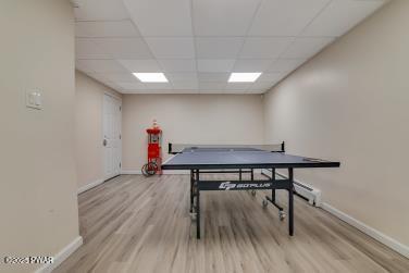 3043 Hemlock Rd, Stroudsburg, PA 18360 - rec room featuring baseboards, wood finished floors, and a drop ceiling