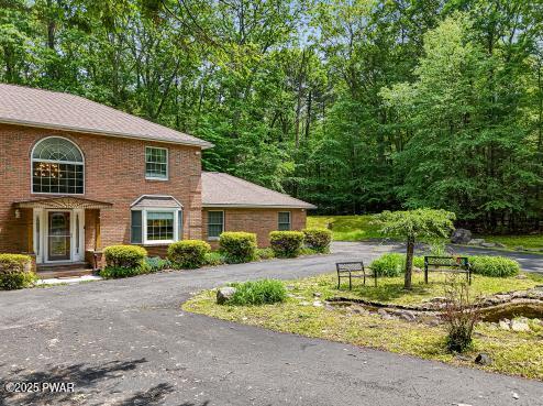 3043 Hemlock Rd, Stroudsburg, PA 18360 - view of property exterior featuring brick siding