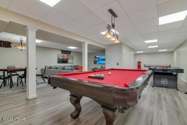 3043 Hemlock Rd, Stroudsburg, PA 18360 - game room featuring wood finished floors, a paneled ceiling, billiards table, and baseboards
