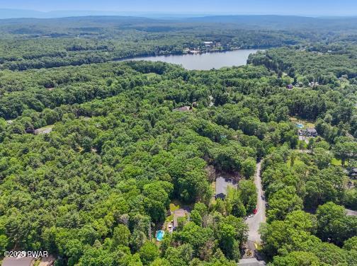 3043 Hemlock Rd, Stroudsburg, PA 18360 - drone / aerial view of a heavily wooded area and a nearby body of water