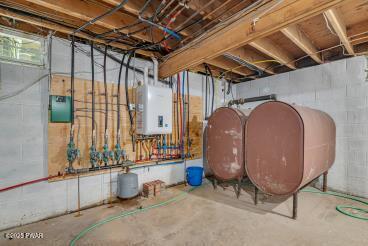 3043 Hemlock Rd, Stroudsburg, PA 18360 - unfinished basement with oil tank and water heater