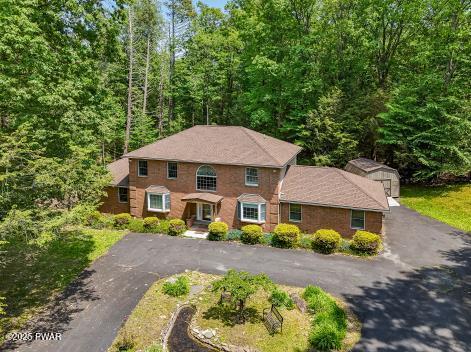 3043 Hemlock Rd, Stroudsburg, PA 18360 - view of front of property featuring asphalt driveway and a forest view
