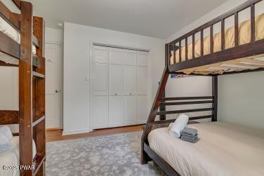 3043 Hemlock Rd, Stroudsburg, PA 18360 - bedroom with wood finished floors and a closet