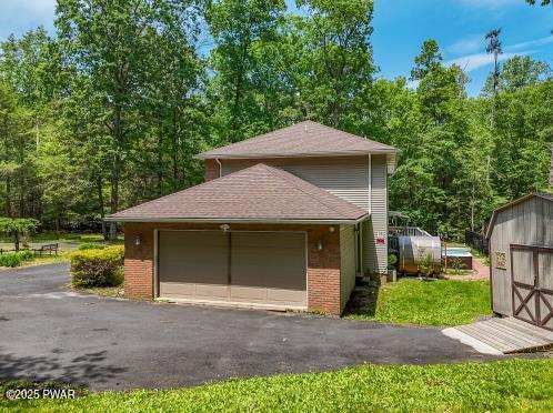 3043 Hemlock Rd, Stroudsburg, PA 18360 - garage featuring a shed