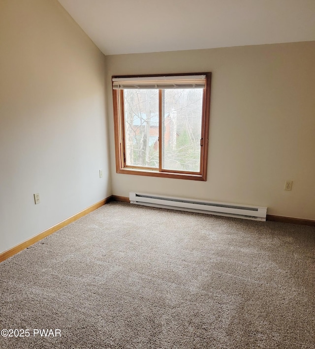 carpeted empty room featuring a baseboard radiator and lofted ceiling