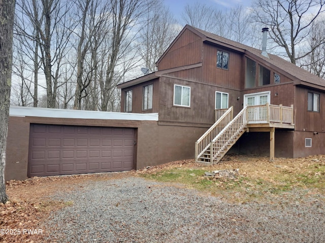 back of property with a garage