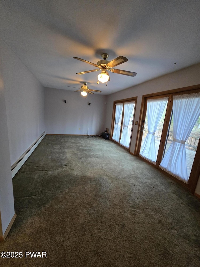 spare room featuring ceiling fan, baseboard heating, and dark colored carpet