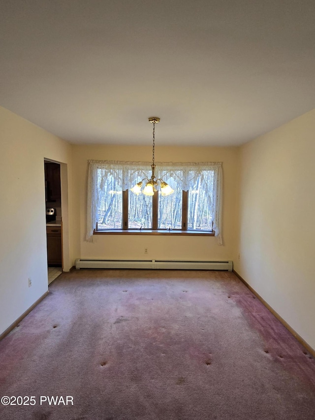 unfurnished dining area featuring an inviting chandelier, baseboard heating, and carpet floors