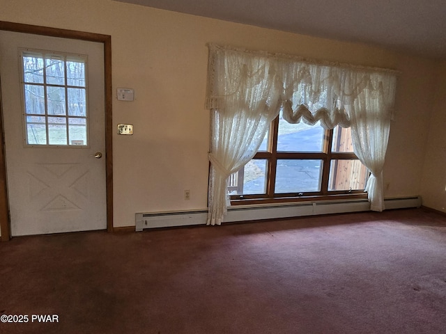 carpeted foyer entrance with a baseboard heating unit and a healthy amount of sunlight