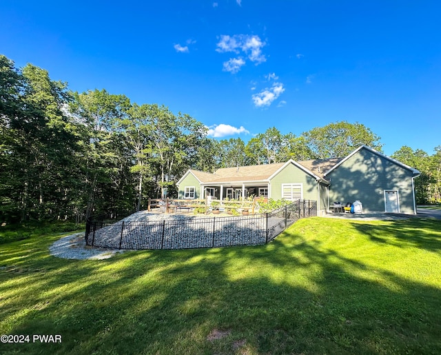 back of house with a yard