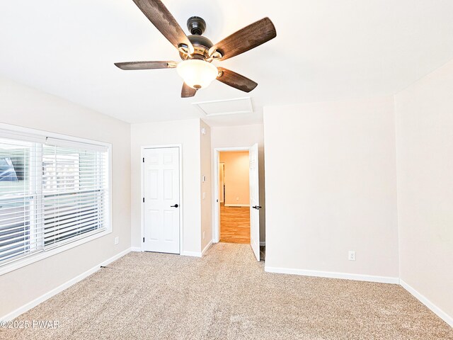 carpeted bedroom with multiple windows and ceiling fan