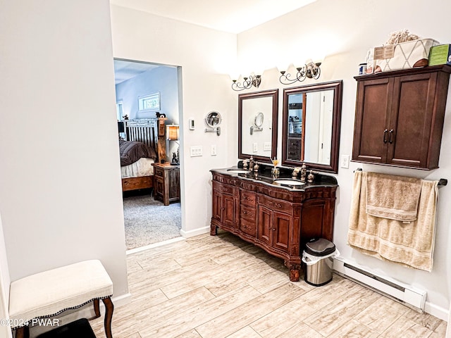 bathroom featuring vanity and a baseboard radiator