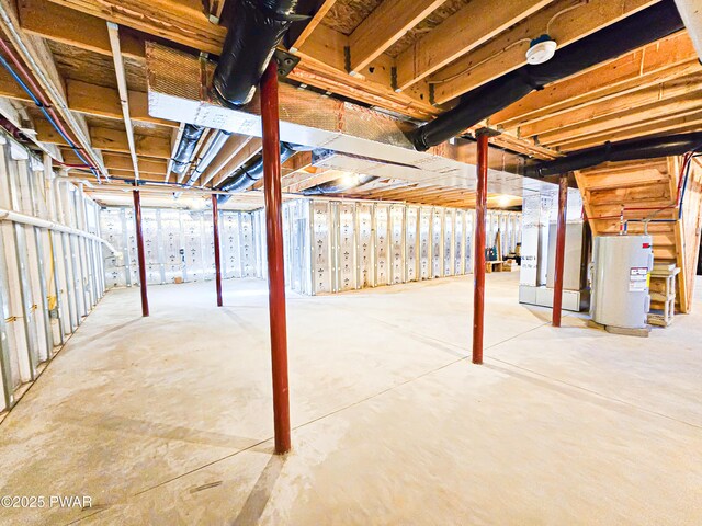 corridor featuring hardwood / wood-style floors, a barn door, and a baseboard heating unit