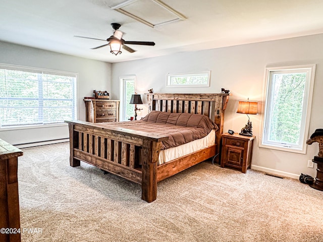 bedroom featuring a baseboard radiator, ceiling fan, and light colored carpet