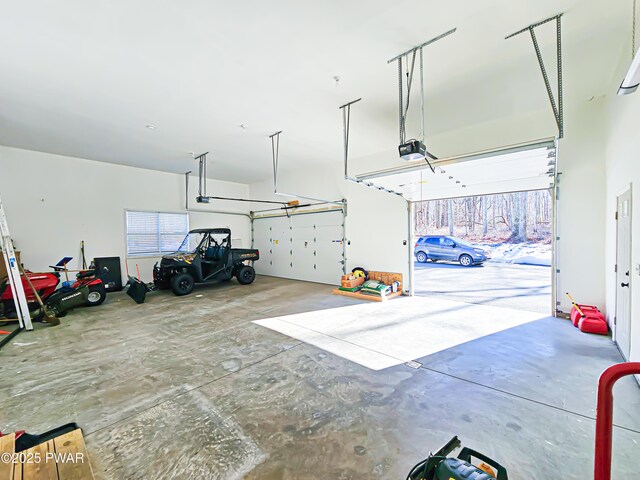 washroom with washing machine and clothes dryer and hardwood / wood-style floors