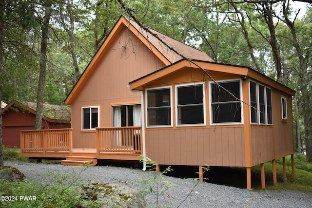 back of house with a wooden deck