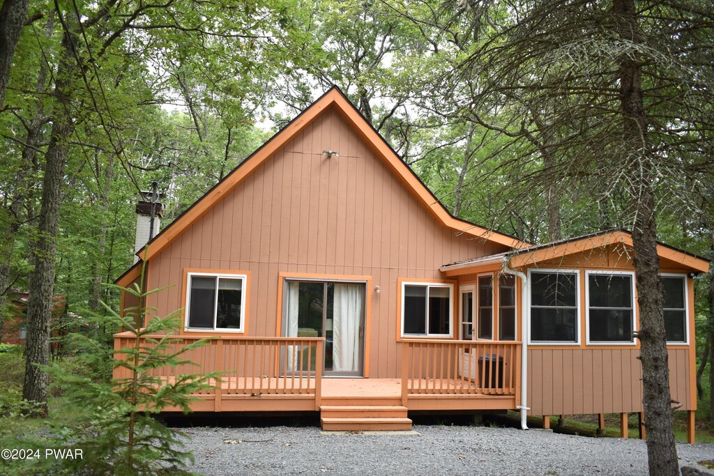 back of property featuring a deck