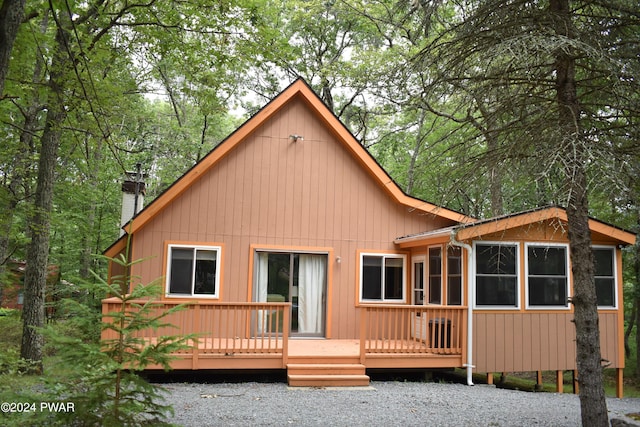 back of property featuring a deck