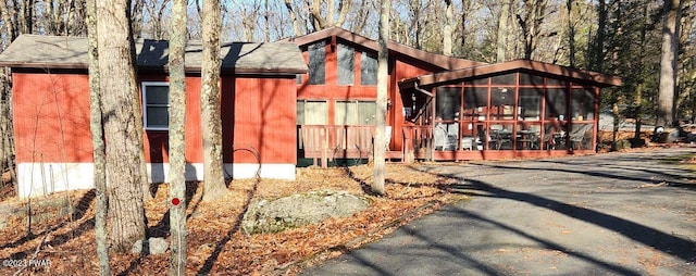 exterior space featuring a sunroom