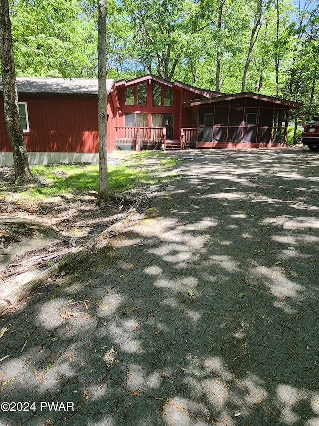 view of yard with a sunroom